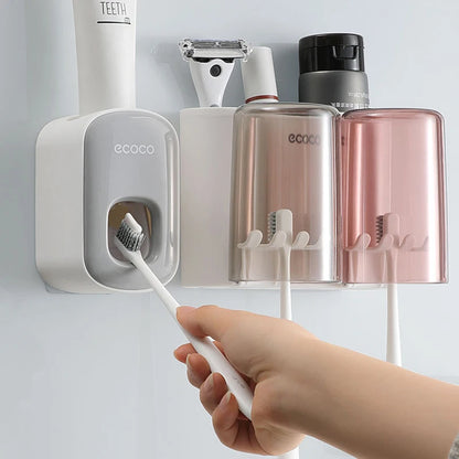 Organisateur de support de brosse à dents de salle de bain avec presse-dentifrice à tasse.